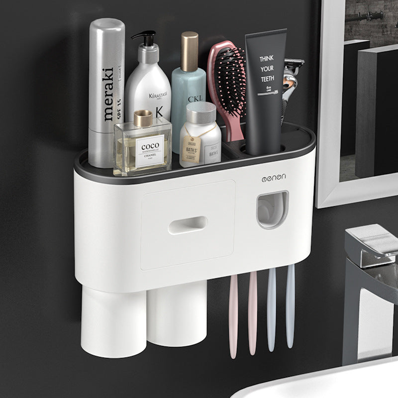 Wall-mounted white toothbrush holder with drawer, six slots, and a pink base insert