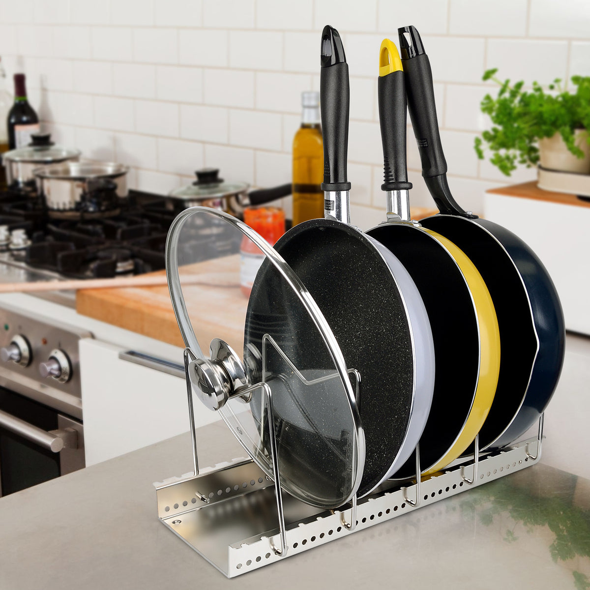 Silver cookware storage rack holding pots and pans with wire side supports