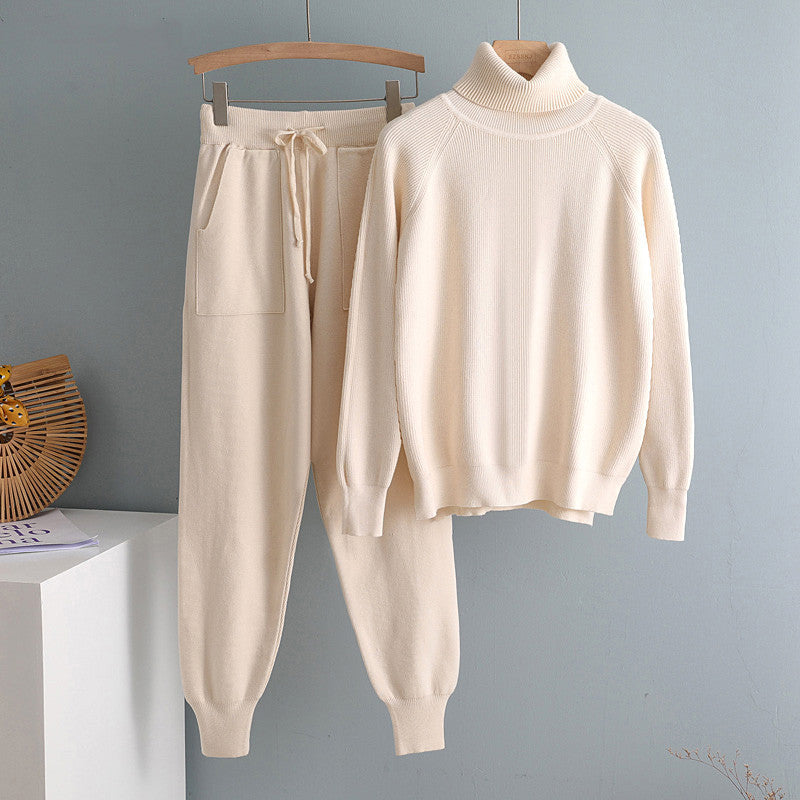 Cream knit turtleneck sweatshirt and jogger pants set hanging side by side