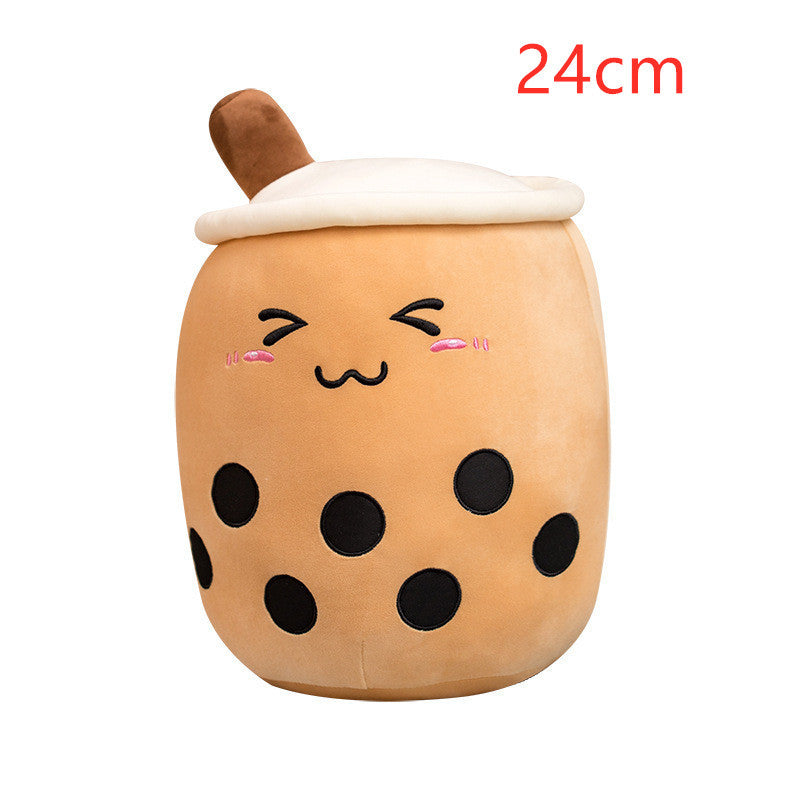 Tan plush bubble tea cup pillow with brown straw, closed eyes, pink blush and black dots
