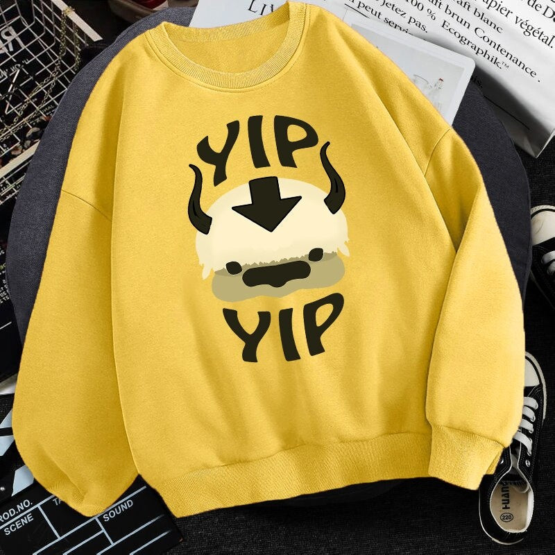 Yellow fleece crewneck sweatshirt with centered character graphic print