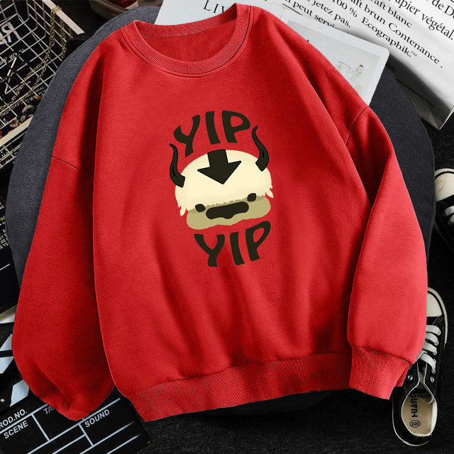 Red fleece crewneck sweatshirt with centered character graphic print