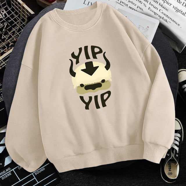 Beige fleece crewneck sweatshirt with centered character graphic print