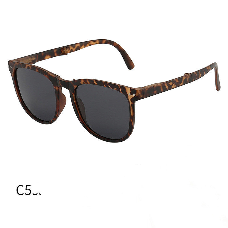 Foldable sunglasses with tortoiseshell frames and dark lenses
