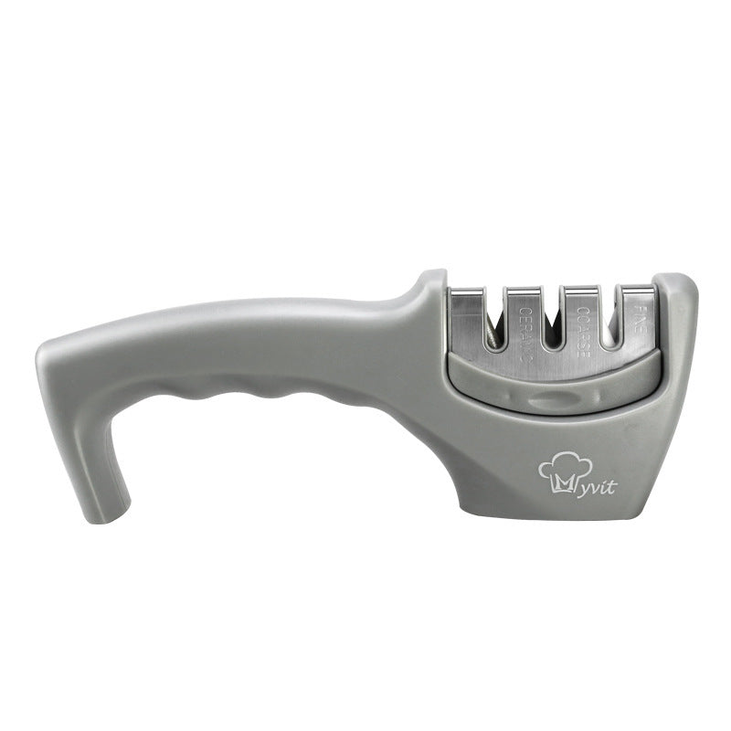 Light gray hand-held knife sharpener with curved handle and four sharpening slots