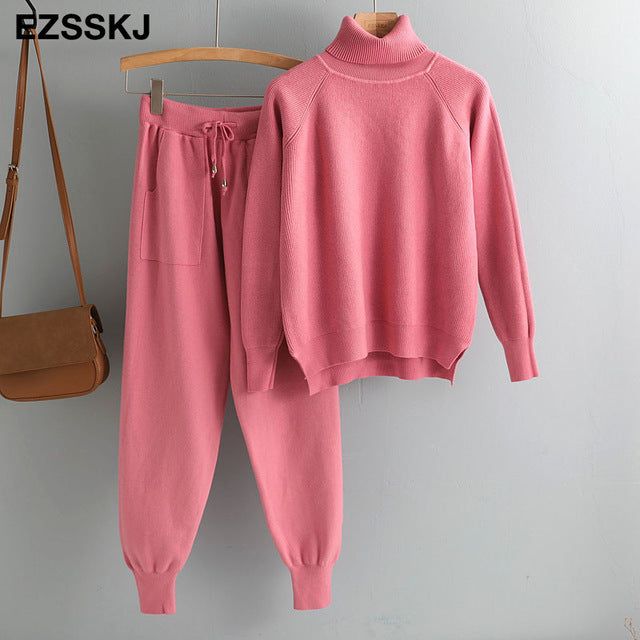Pink knitted turtleneck tracksuit top and jogger pants set with drawstring waist