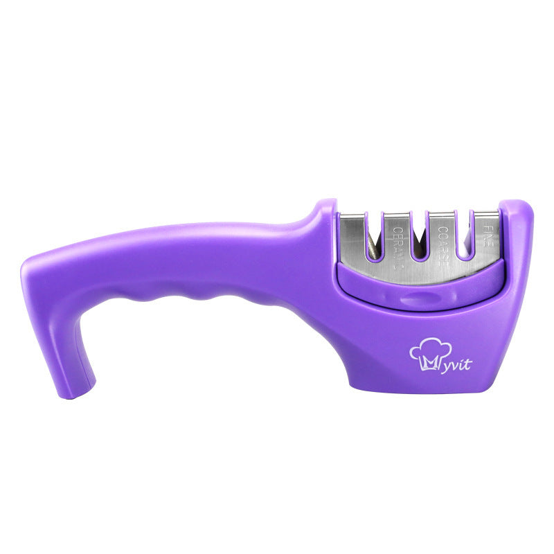 Purple handheld knife sharpener with metal sharpening slots and curved handle