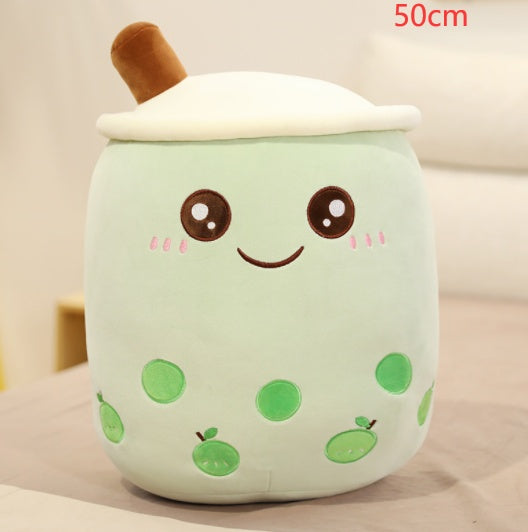 Mint green plush boba tea cup pillow with brown straw, white top, smiling face and green dot pattern