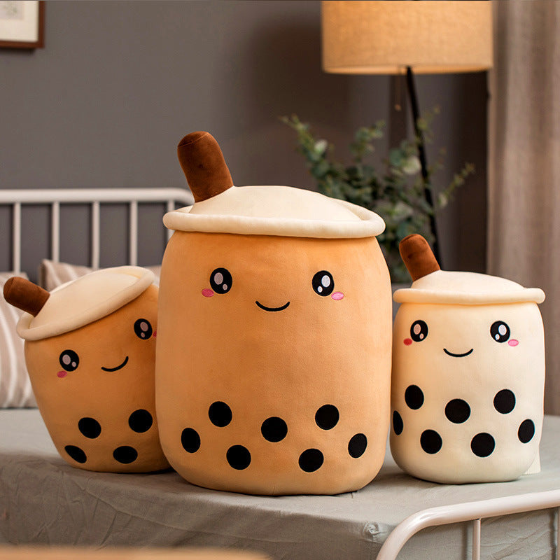 Set of three plush bubble tea cup pillows: tan center, white side cups with brown straws
