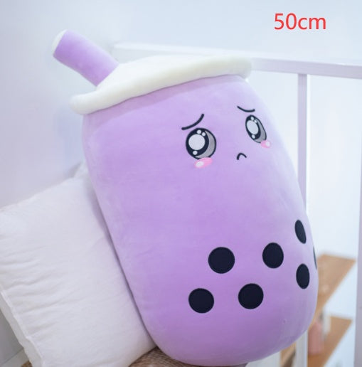 Purple boba drink plush pillow with white lid and straw, smiling face and black dot pattern