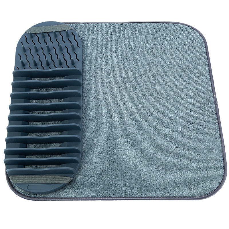 Light gray dish draining rack mat with vertical ridges on one side