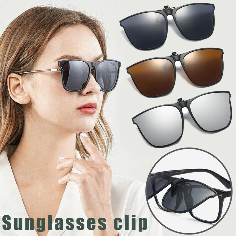 Woman wearing black clip-on sunglasses over glasses, dark tinted lenses