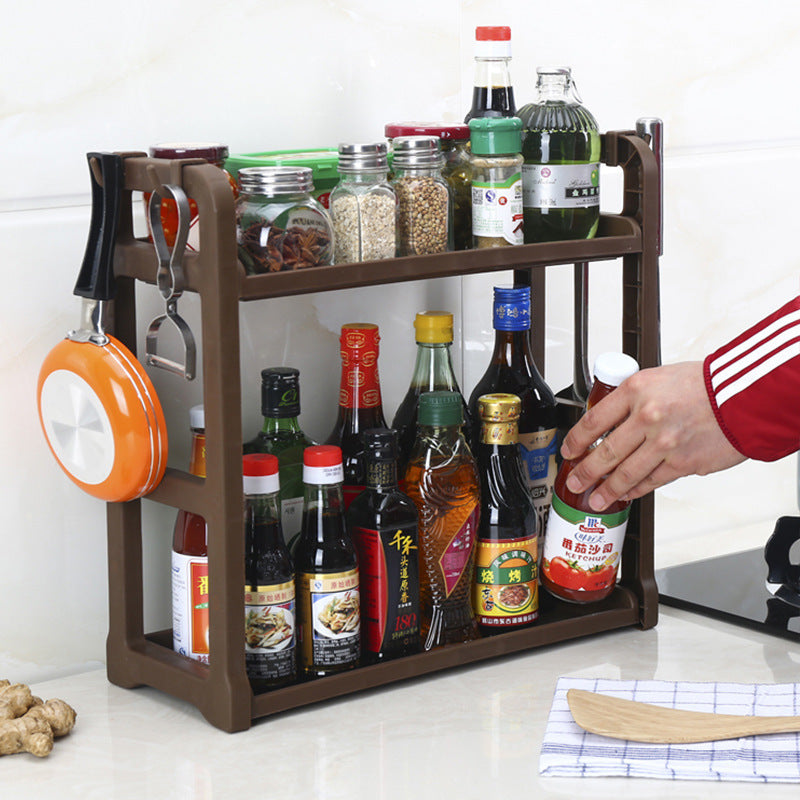 Dark brown rack with utensil hooks and two shelves for jars and bottles