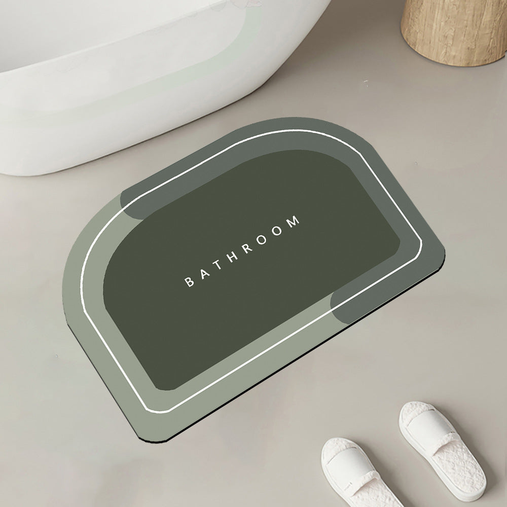 Quick-drying bathroom floor mat, dark green rounded rectangle with white border and handle shape