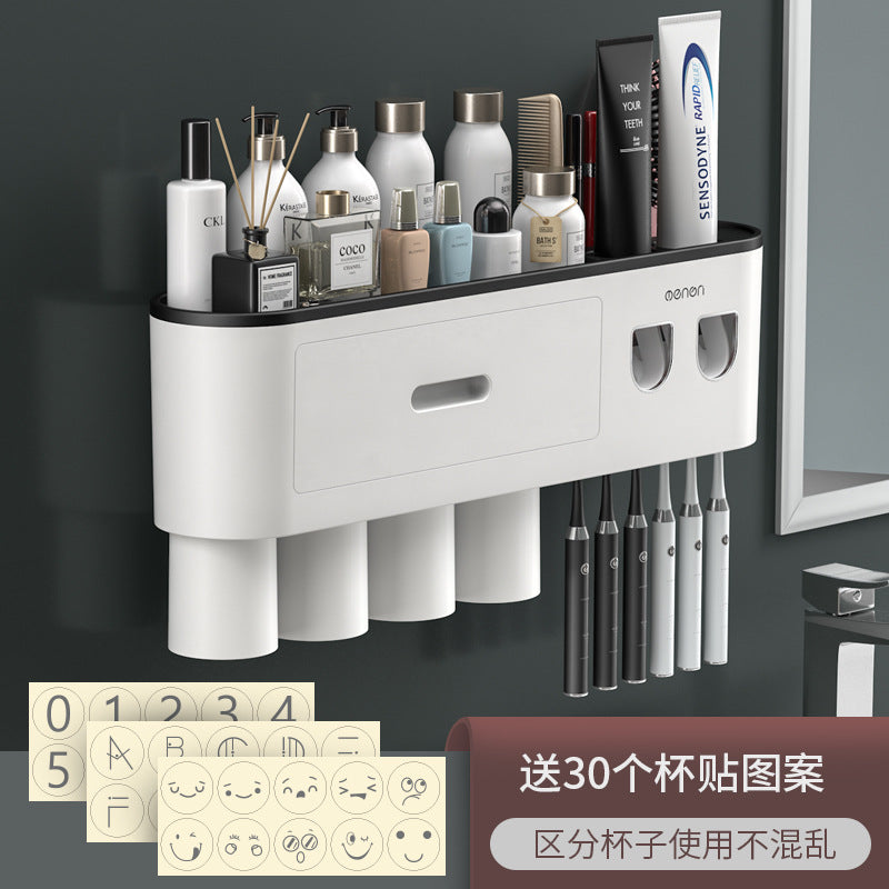 White wall-mounted toothbrush holder with center drawer, multiple cup slots, and pen-style toothbrush slots.