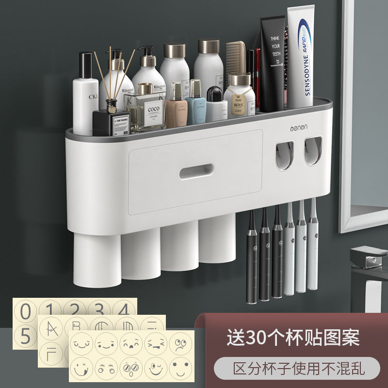 White wall-mounted toothbrush organizer with drawer, cup slots, and multiple toothbrush slots on right.