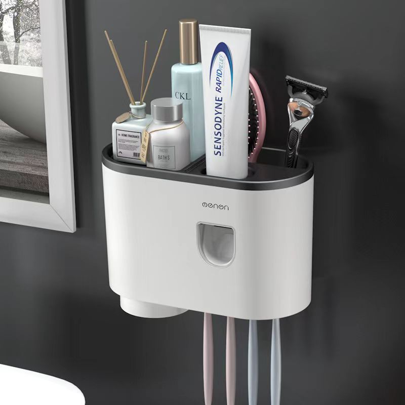 White wall-mounted toothbrush holder with rounded cup section, single compartment, and vertical brush slots.