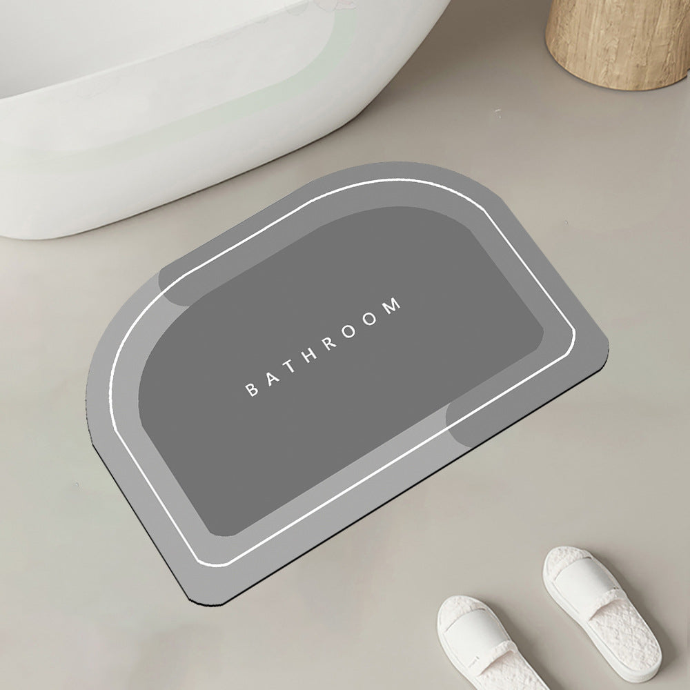 Quick-drying bathroom floor mat, gray with white border outline, rounded rectangle shape