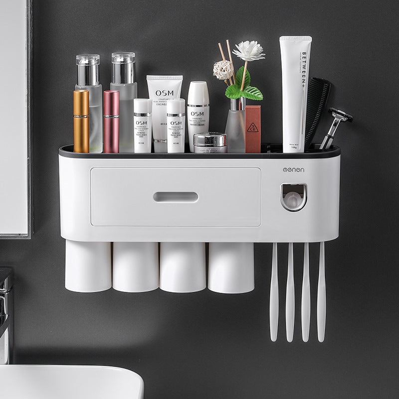 White bathroom toothbrush organizer with pink top rail, drawer panel, and brush slot openings