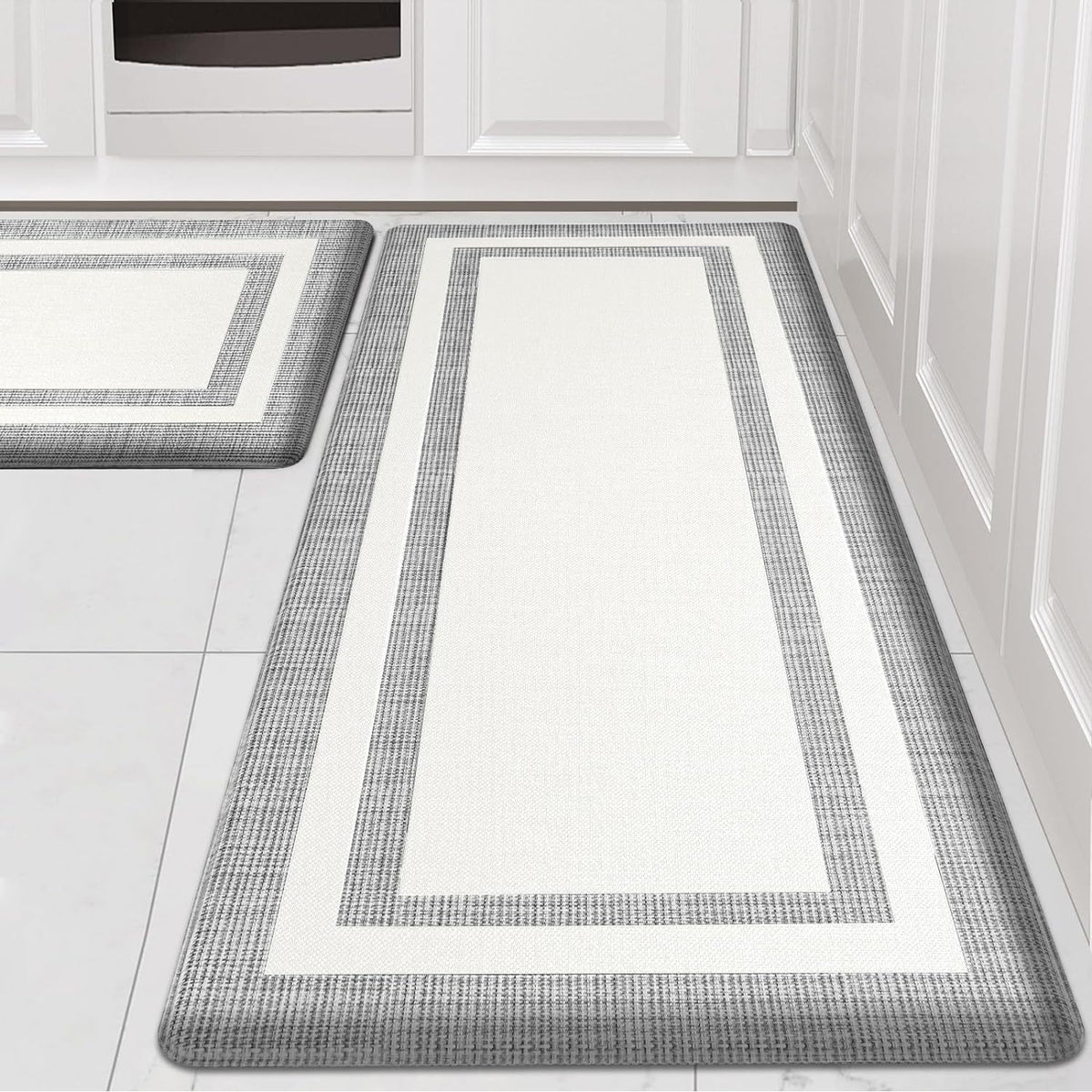 Kitchen floor mat set: two dark gray runner mats with white border stripes on tile and wood