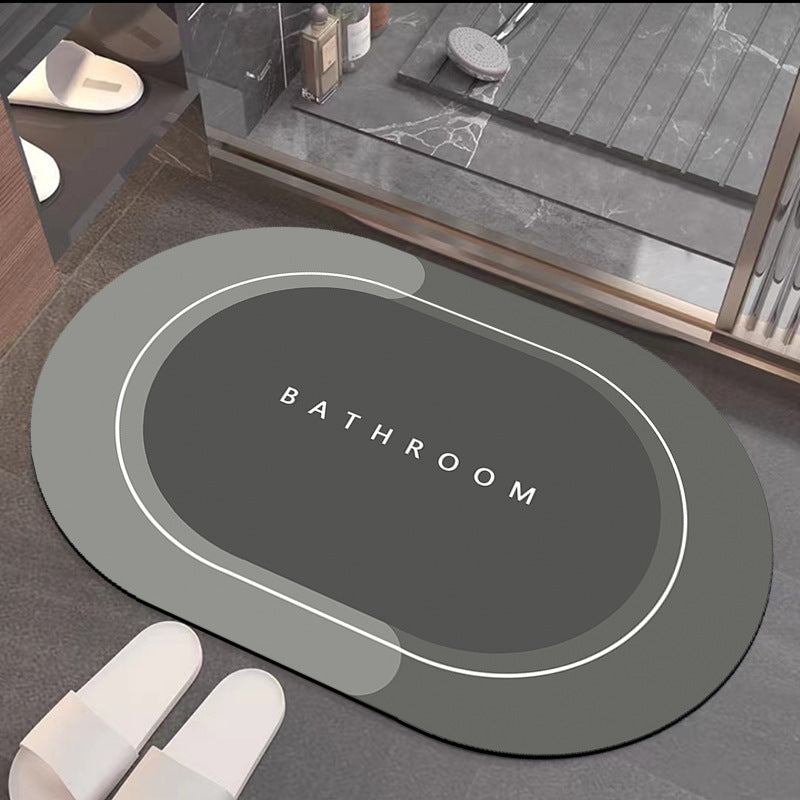 Quick-drying bathroom floor mat, medium gray with white border outline and ���BATHROOM��� text
