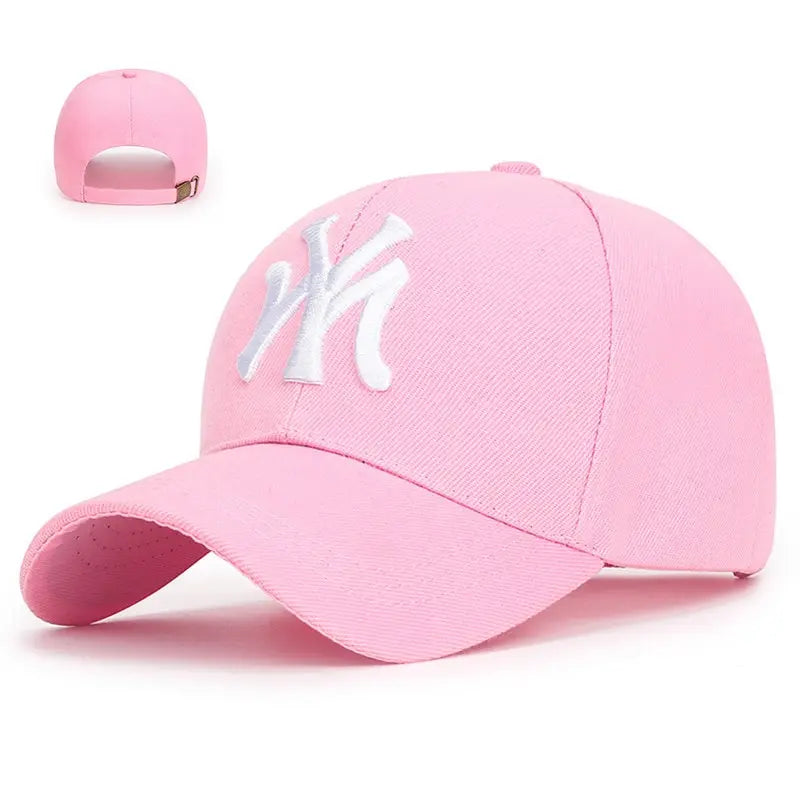 Pink baseball cap with curved brim and white NY logo patch on front