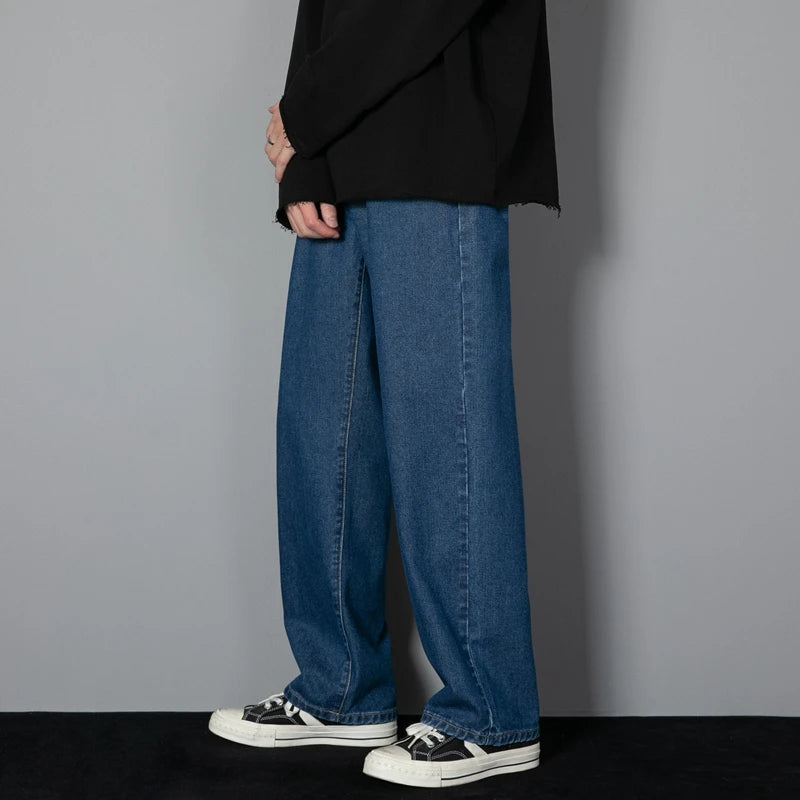 Medium blue wide-leg denim jeans with relaxed straight legs and front pockets