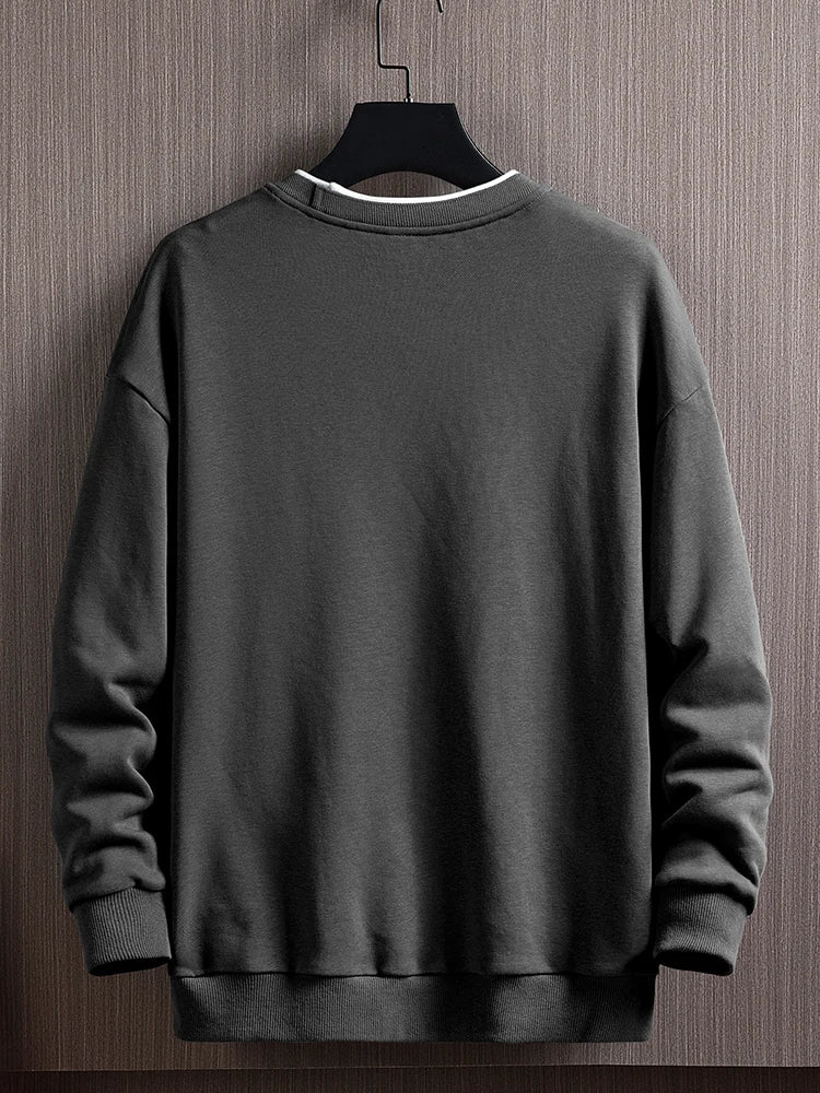 Men's dark gray round-neck pullover sweater with ribbed cuffs and hem