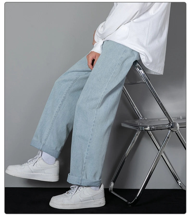Wide-leg light wash denim jeans with loose fit and vertical seam stitching