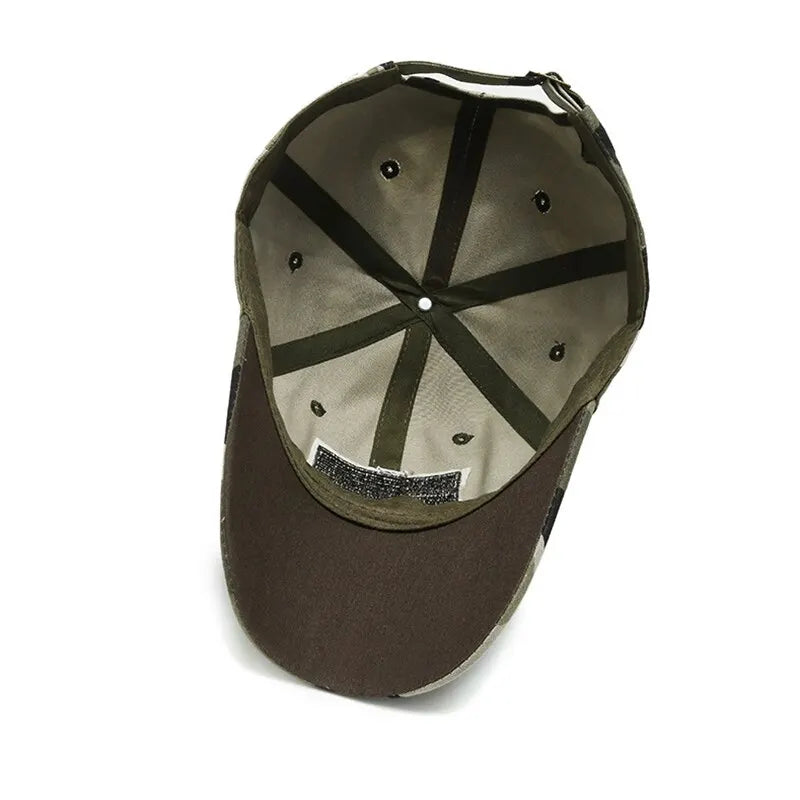Camouflage baseball cap with curved brim and dark crown panel seams, front view.