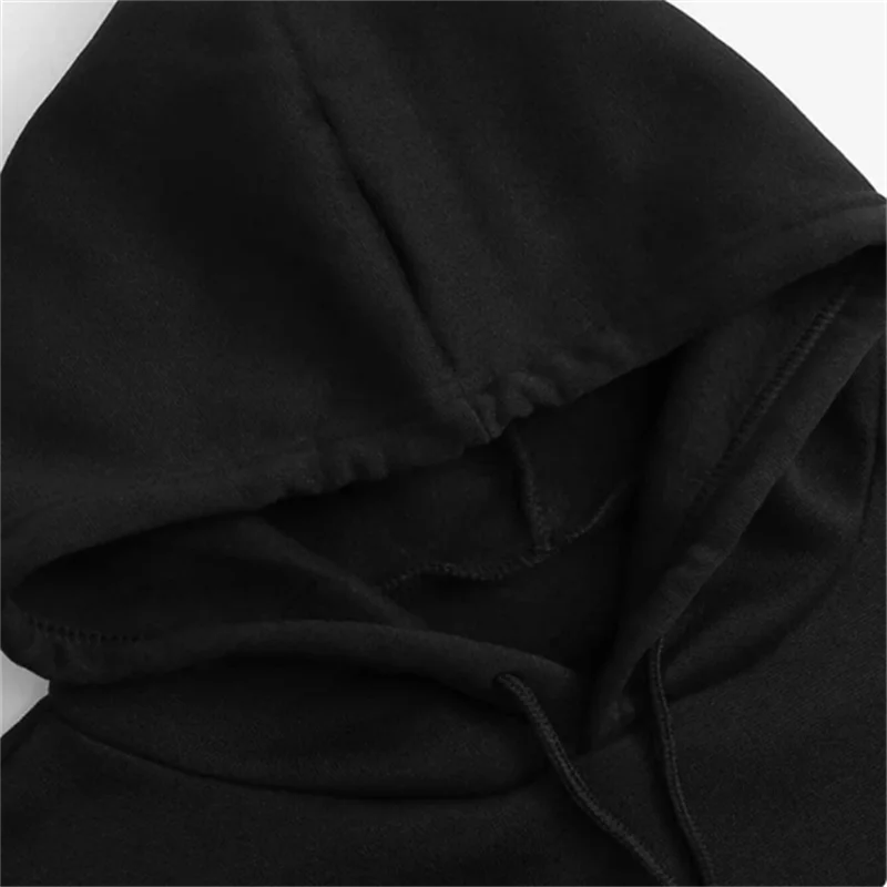 Black pullover hoodie hood with drawstring and front pocket seam.