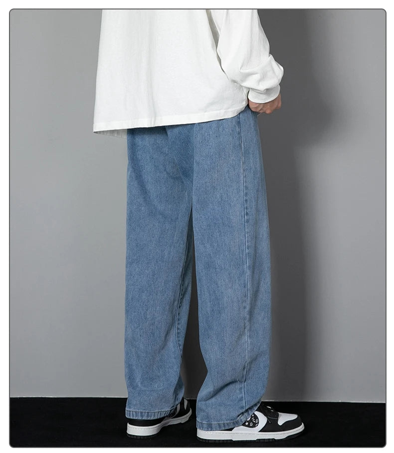 Mens wide-leg long jeans, light blue denim, relaxed straight legs, deep front crease