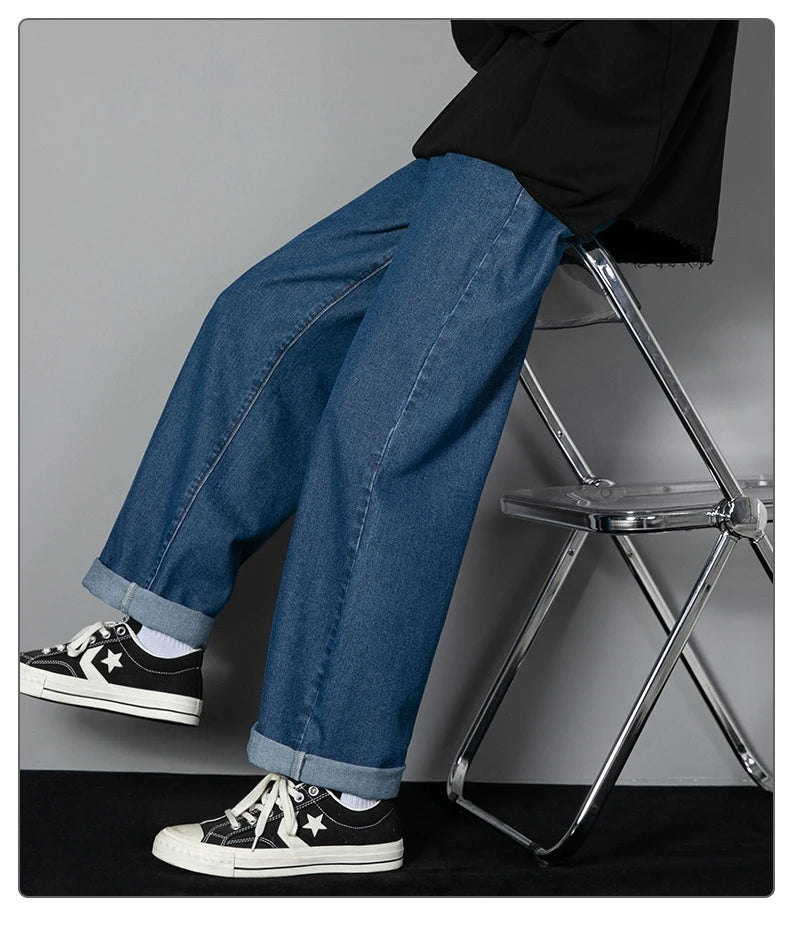 Mens wide-leg long jeans, medium blue denim, wide leg silhouette, stitched hem cuff