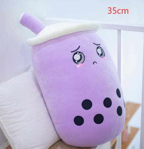 Purple plush boba drink pillow with white lid and straw, cute teary eyes and black dots