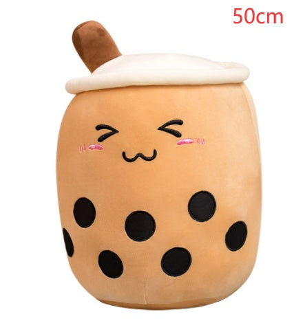 Brown plush boba tea cup pillow with white lid, smiling face, and brown straw