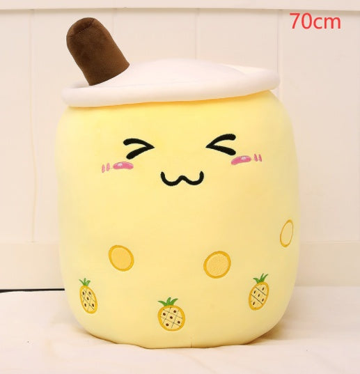 Yellow plush boba tea cup pillow with brown straw and pineapple print pattern