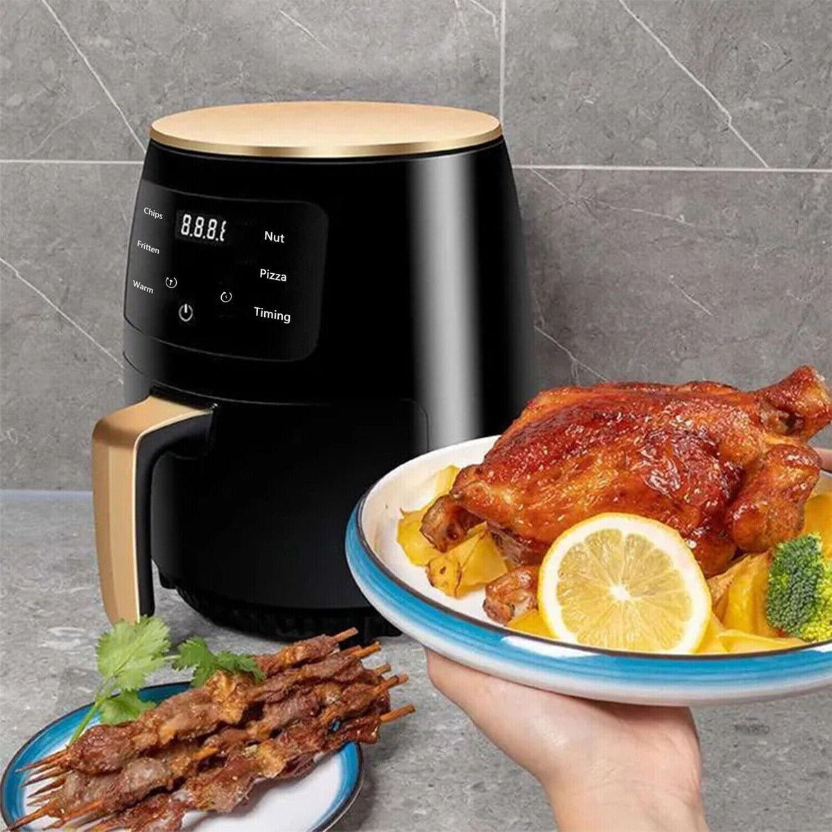 Black air fryer with beige handle on countertop, serving fried chicken with lemon