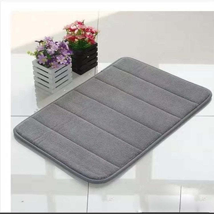 Gray non-slip washable toilet floor mat with quilted stripes and rounded edges