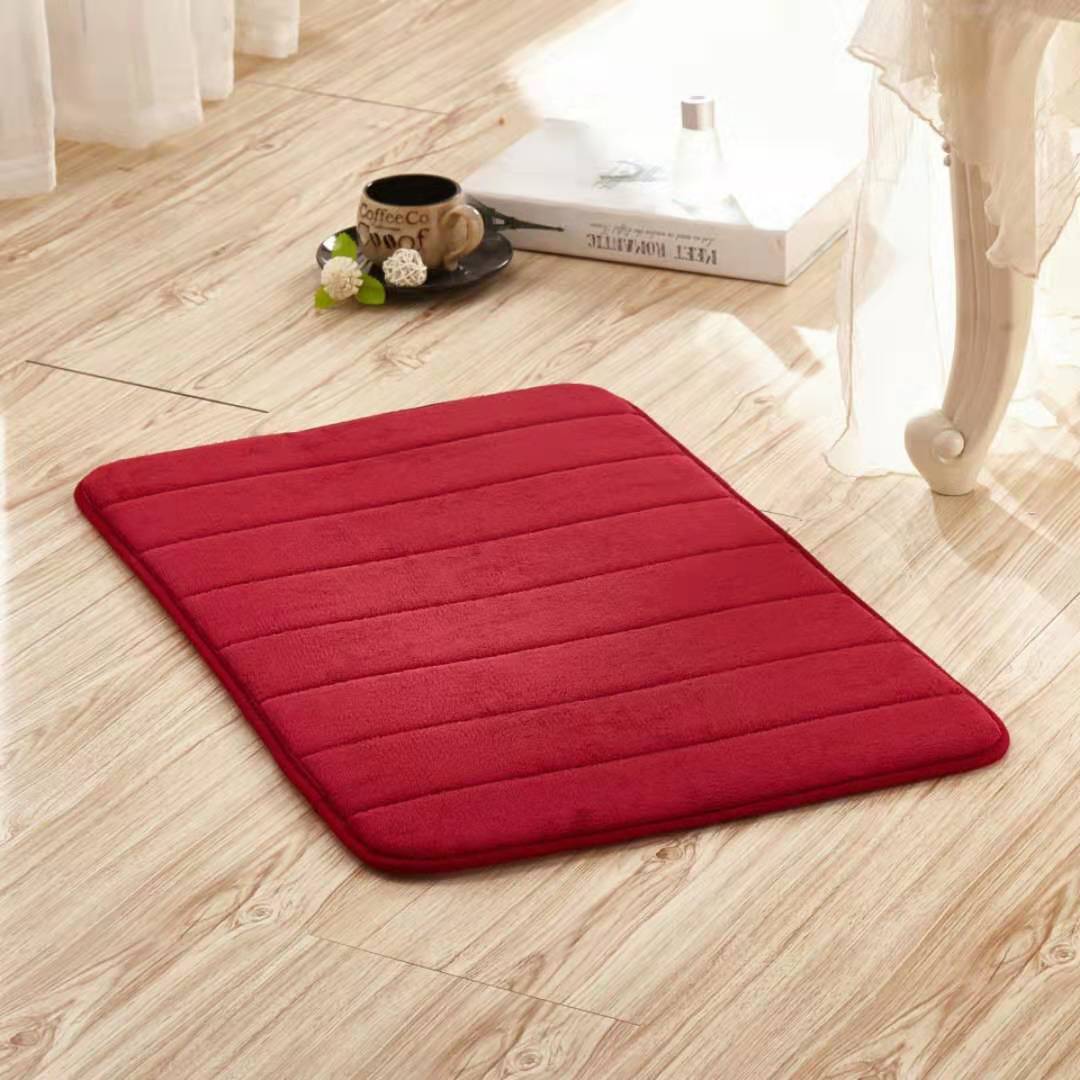 Red non-slip washable toilet floor mat with quilted stripes and rounded edges