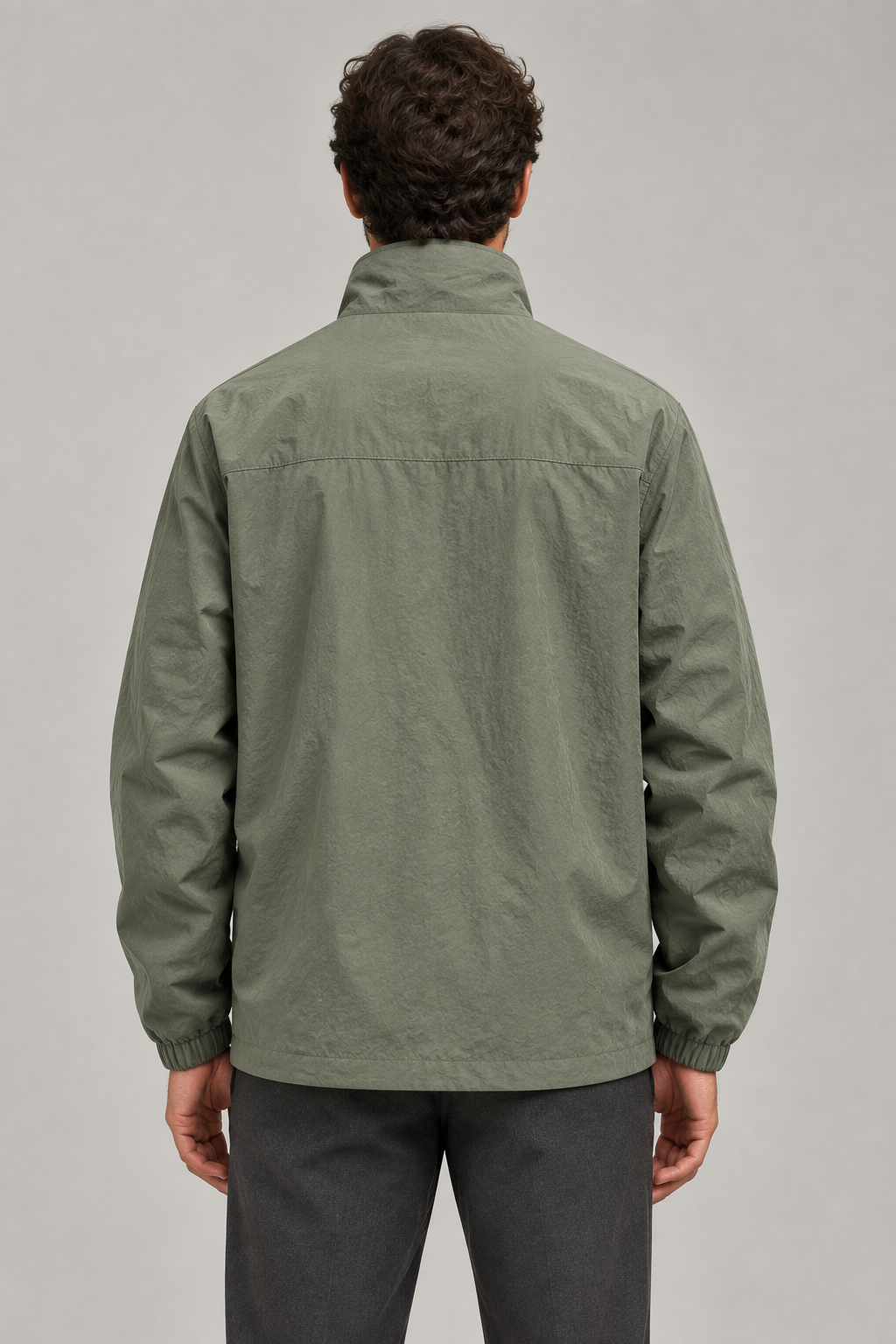 Green jacket back view with the matching slim model