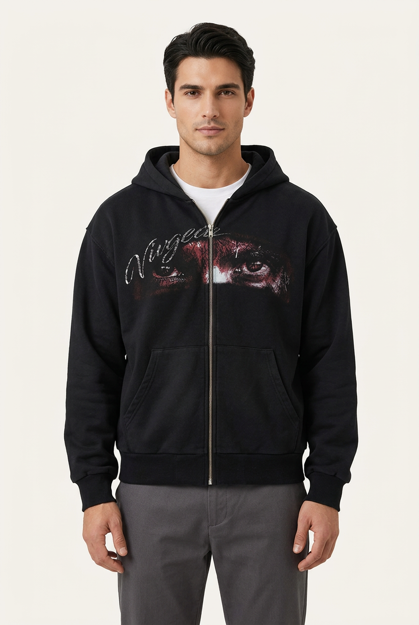 Black eye graphic zip-up hoodie on male model, front view