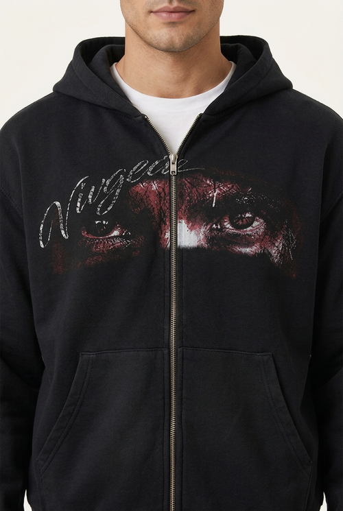 Black hoodie eye graphic and zipper detail on model